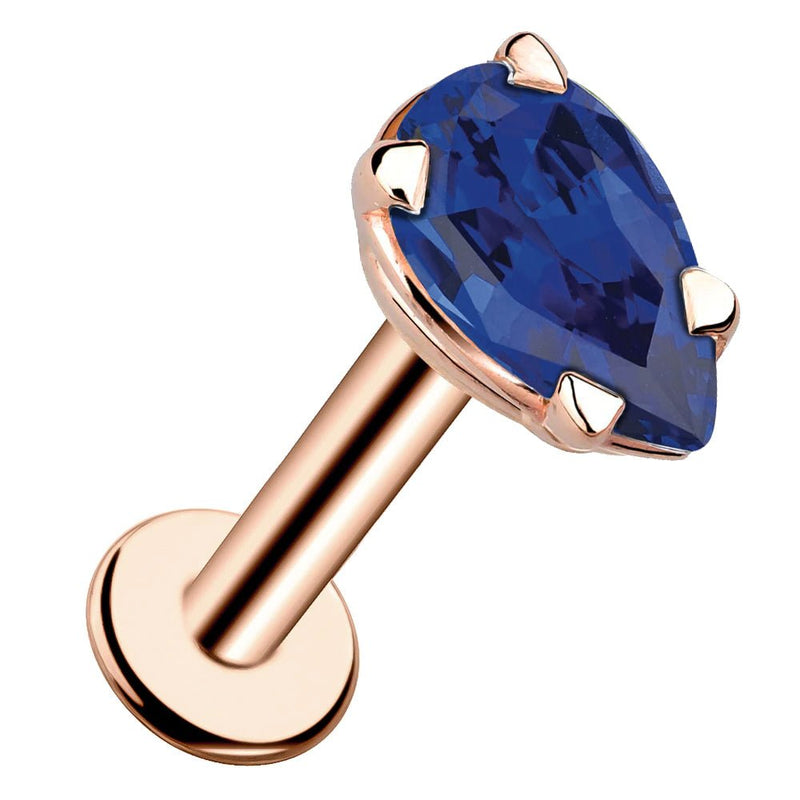 14k rose gold pear-cut blue sapphire flat back labret stud, angled view showing prong setting and flat disc back
