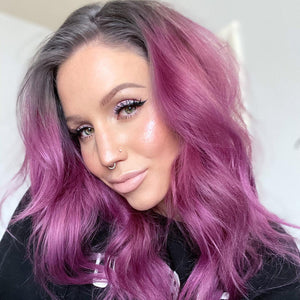 CZ pavé gold clicker ring worn as a nose ring on model with pink-purple hair