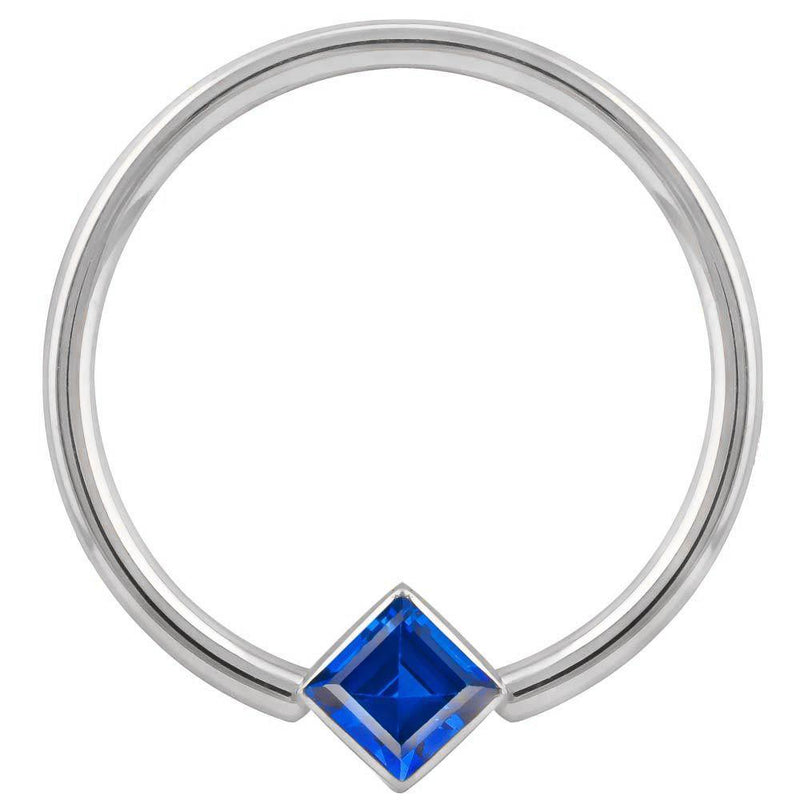14k white gold fixed bead ring with blue princess-cut CZ in corner bezel mount, front view