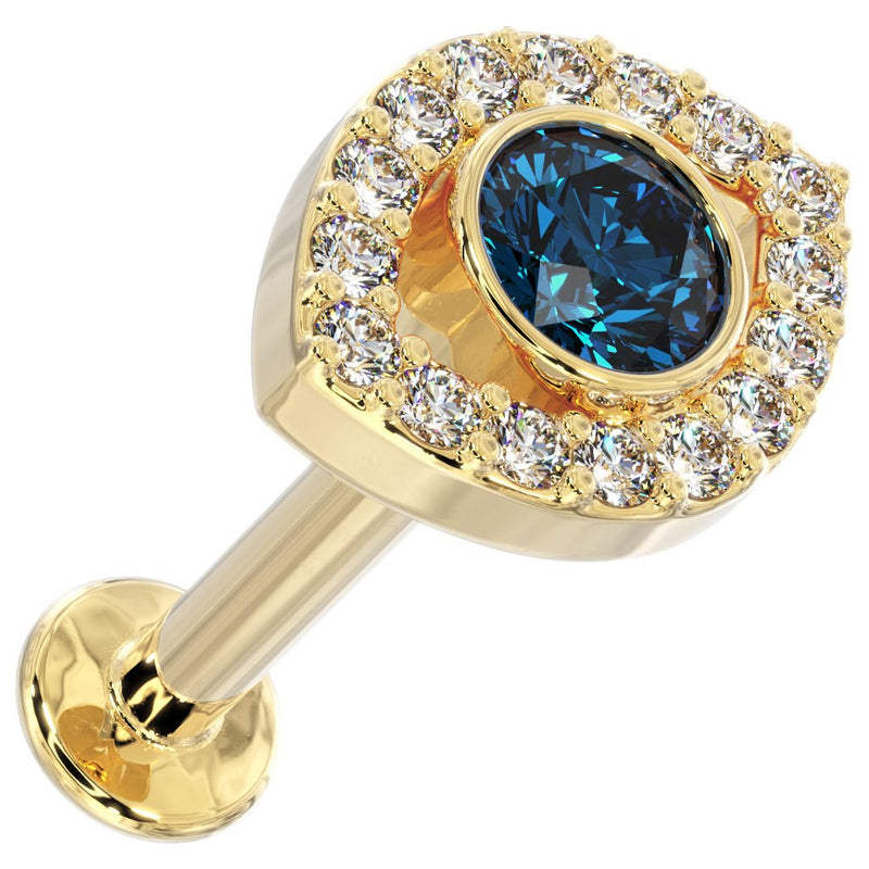 14k yellow gold evil eye flat back stud, angled top view showing blue topaz and diamond halo detail