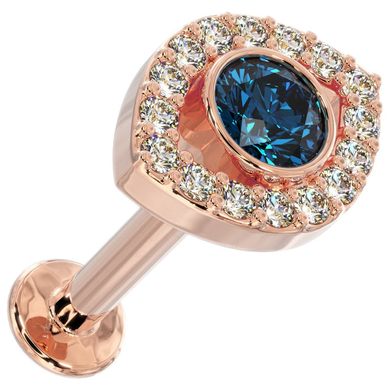 14k rose gold evil eye flat back stud, angled top view showing blue topaz center and diamond halo setting