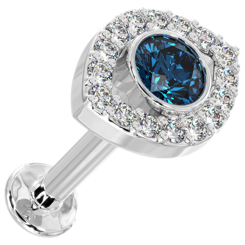 14k white gold evil eye flat back stud, angled top view showing bezel-set blue topaz and surrounding diamonds