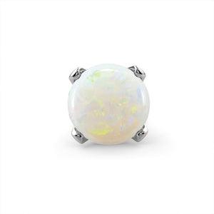 Close-up of genuine opal cabochon in four-prong setting, showing multicolor fire and play of light