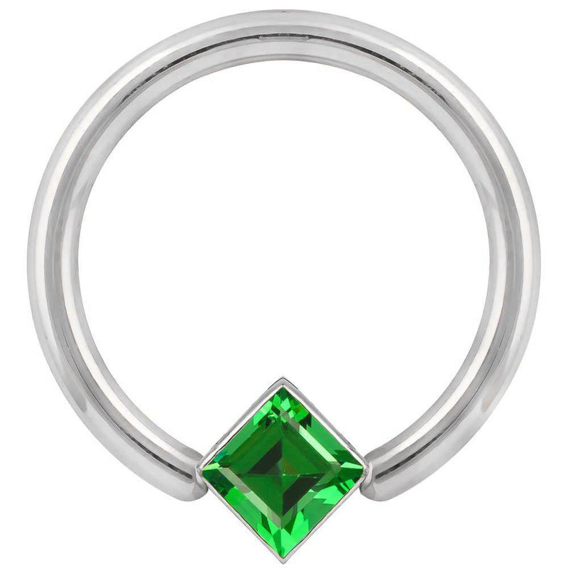 Close-up front view of white gold fixed bead ring highlighting the green princess-cut CZ corner mount