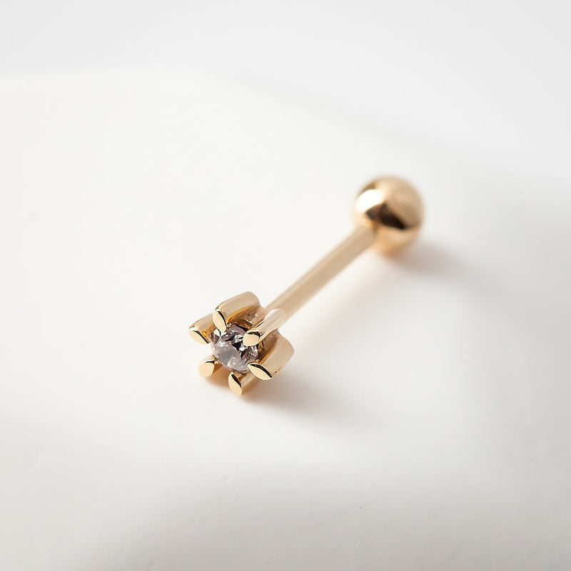 14k yellow gold diamond flower helix stud on white surface, angled view showing petal detail and ball end