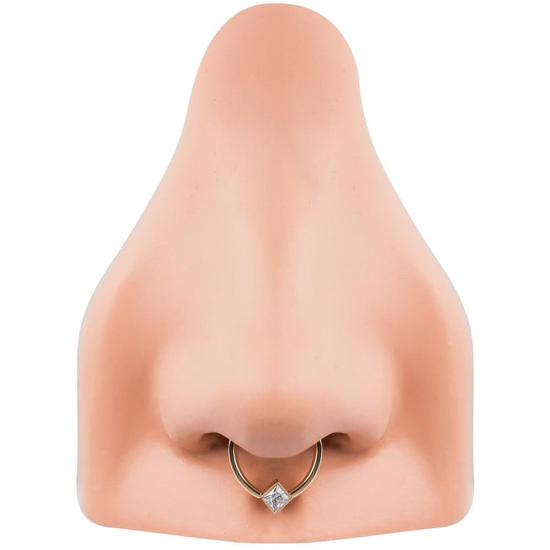 14k gold princess-cut CZ corner mount fixed bead ring worn as septum ring on nose model