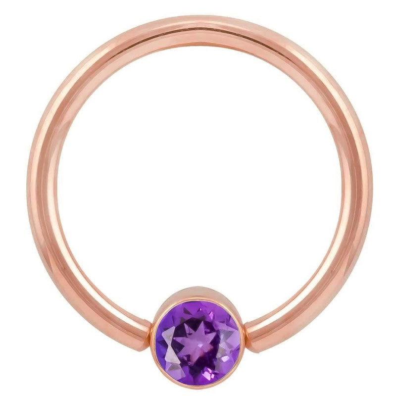 14k rose gold purple CZ fixed bead ring, larger gauge showing warm tone contrast with purple stone