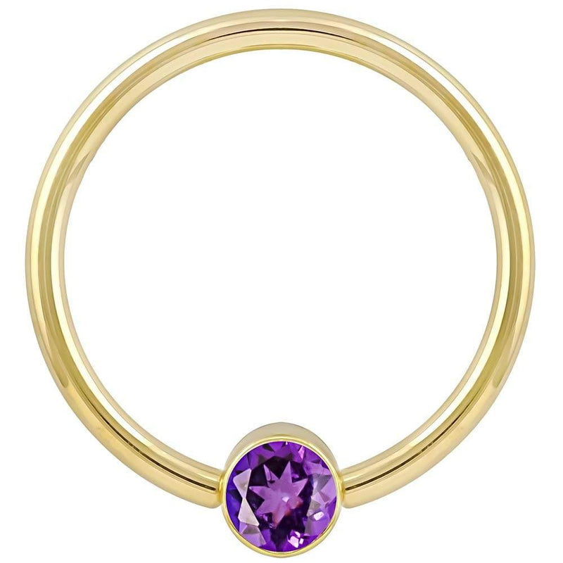 14k yellow gold purple CZ fixed bead ring, smaller gauge highlighting bezel-set stone