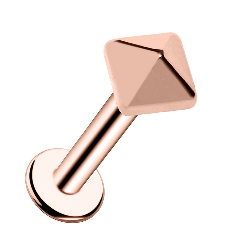 14k rose gold pyramid flat-back labret stud, angled product view showing warm-toned faceted pyramid charm and disc
