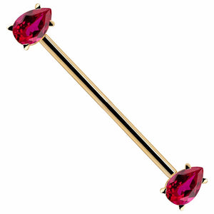 14k yellow gold industrial barbell with dual red pear-cut CZ gems in prong settings, angled view