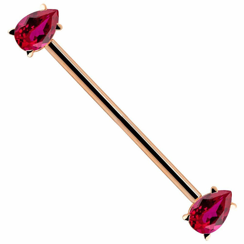 14k rose gold industrial barbell with red pear-cut CZ gemstones in prong settings, angled view