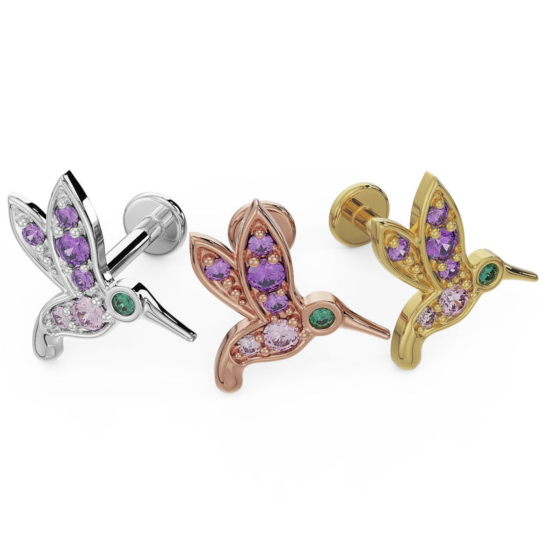 Side-by-side comparison of hummingbird labret earrings in white gold, rose gold, and yellow gold, front view