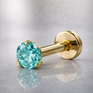 14k yellow gold aqua diamond flat back labret stud, angled view showing 3-prong setting and post