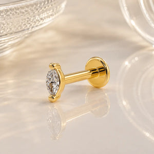 14k yellow gold marquise diamond flat back labret with disc backing, angled lifestyle shot