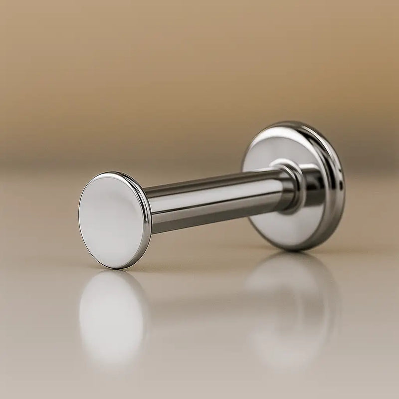 14K white gold 2.5mm disc flat back labret stud, angled view showing post and flat disc backing