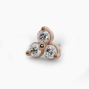 Overhead close-up of 14k rose gold trinity diamond stud end showing three round diamonds in warm rose setting