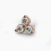 Close-up overhead view of 14k rose gold trinity diamond nose stud end showing warm gold setting detail