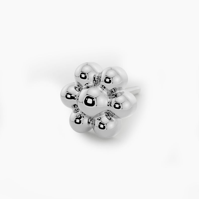 Macro close-up of 14k white gold beaded flower end on threadless pushpin post