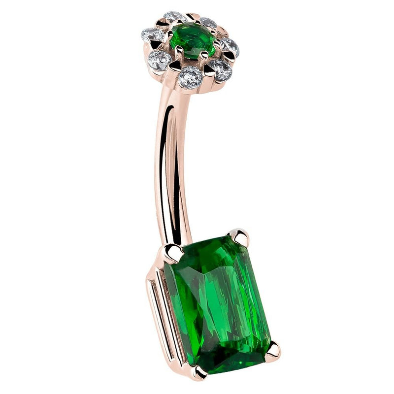 14k rose gold belly ring with emerald cut green CZ bottom and daisy flower cluster top, angled view
