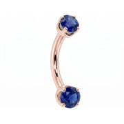 14k rose gold dainty 18G curved barbell with two 2mm round blue sapphires, angled view