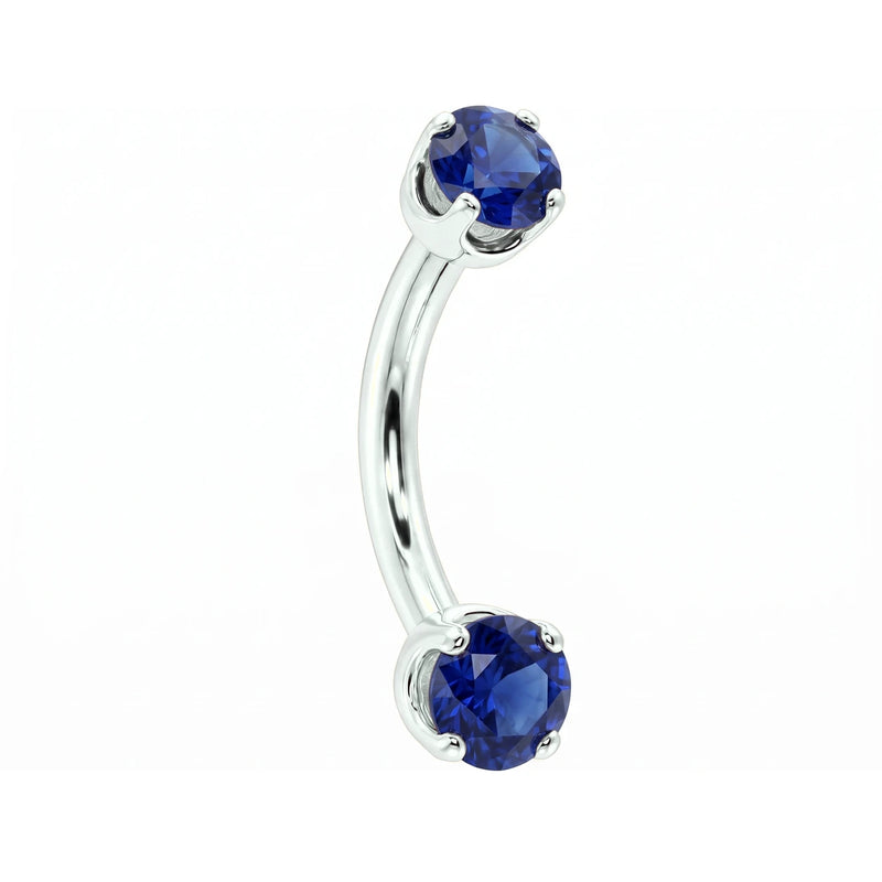 14k white gold dainty 18G curved barbell with two 2mm round blue sapphires, angled view