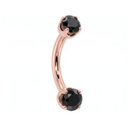 14k rose gold dainty 18G curved barbell with two 2mm round black diamonds, angled view