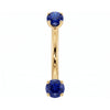 14k yellow gold dainty 18G curved barbell with two 2mm round blue sapphires, front view