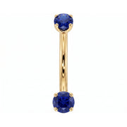 14k yellow gold dainty 18G curved barbell with two 2mm round blue sapphires, front view