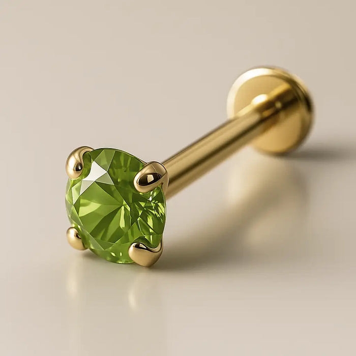 2mm peridot 14K yellow gold flat back labret with four-prong setting, angled product view