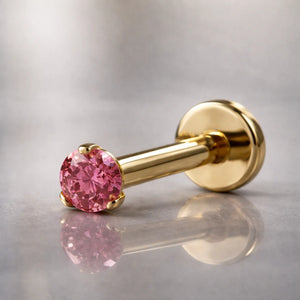 14k yellow gold 2mm pink diamond flat back labret stud, angled studio shot showing post and flat disc