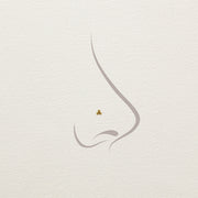 Illustration of 14k gold trinity bead cluster threadless end worn as a nose piercing stud, placement diagram