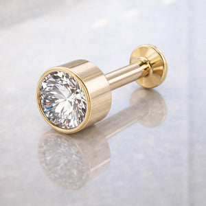 14k yellow gold 3.5mm diamond bezel flat back labret stud, angled view on marble surface