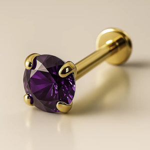 14K yellow gold flat back labret with 3mm deep purple amethyst in four-prong setting, angled view