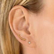 3mm heart diamond flat back stud worn in lobe piercing, styled in gold ear stack with bar climber