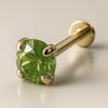 3mm peridot 14K yellow gold prong-set flat back labret, angled view showing gem facets and flat disc
