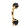 14k yellow gold curved barbell with two 4mm round black diamonds, angled view