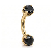 14k yellow gold curved barbell with two 4mm round black diamonds, angled view
