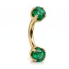 14k yellow gold curved barbell with two 4mm round emeralds, angled view