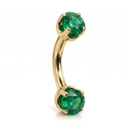 14k yellow gold curved barbell with two 4mm round emeralds, angled view