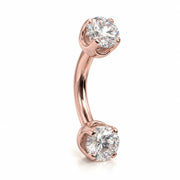 14k rose gold curved barbell with two 4mm round clear gems, angled view