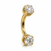Side view of 14k gold curved barbell with 4mm clear stones