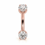 14k rose gold curved barbell with two 4mm round clear gems, front view