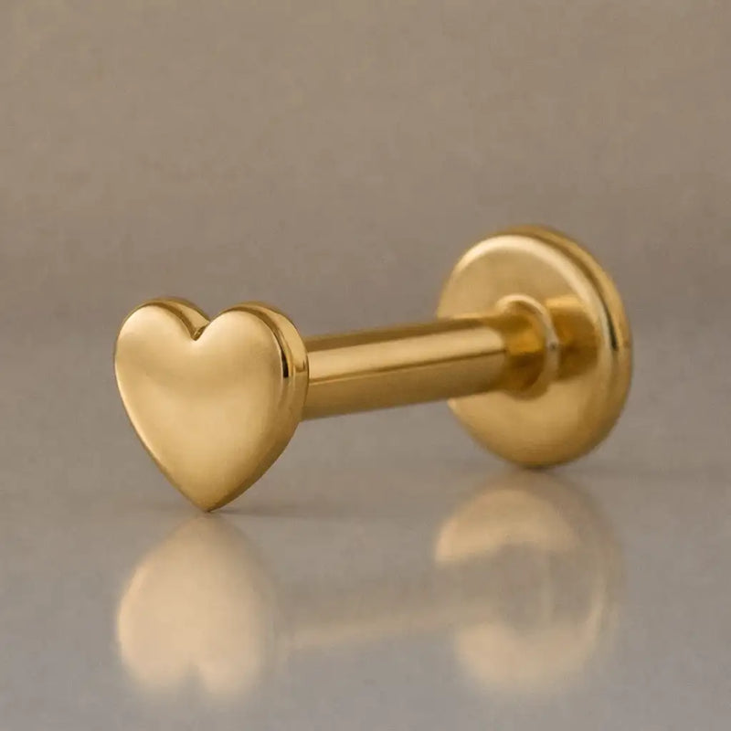 14K yellow gold polished heart flat back labret, angled view showing barbell and disc backing