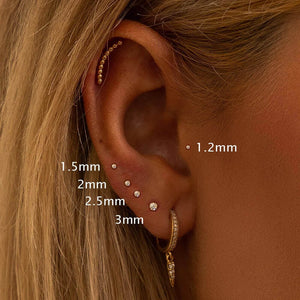 Size guide showing diamond solitaire studs 1.2mm to 3mm worn in pierced ear cartilage and lobe