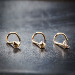 14k yellow gold moon, heart, and star charm nose ring set of three displayed side by side