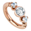 14k rose gold three-CZ clicker cartilage ring with bezel-set center CZ and two prong-set accent stones