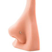 14k gold diamond moon nose ring shown in pierced nose for size and fit reference