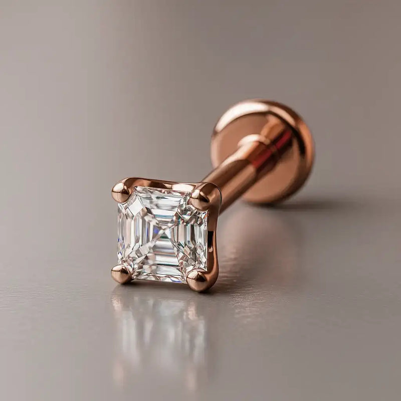 14k rose gold Asscher-cut diamond flat back labret stud, angled studio shot with warm gold tone