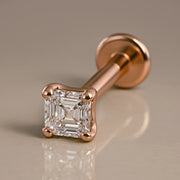 14k rose gold Asscher-cut diamond flat back labret stud, angled studio shot showing post and disc