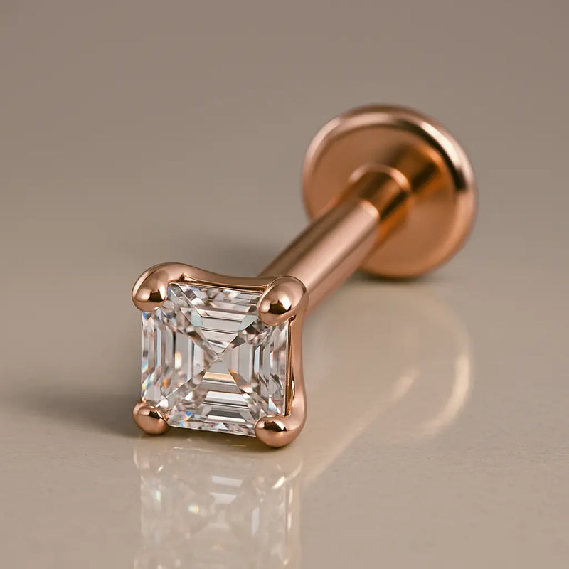 14k rose gold Asscher-cut diamond flat back labret stud, angled studio shot showing post and disc